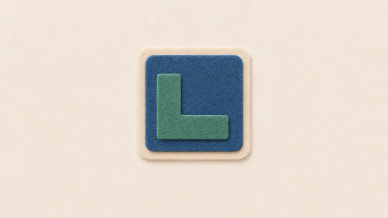 A green felt corner piece on a blue felt square with a cream border
